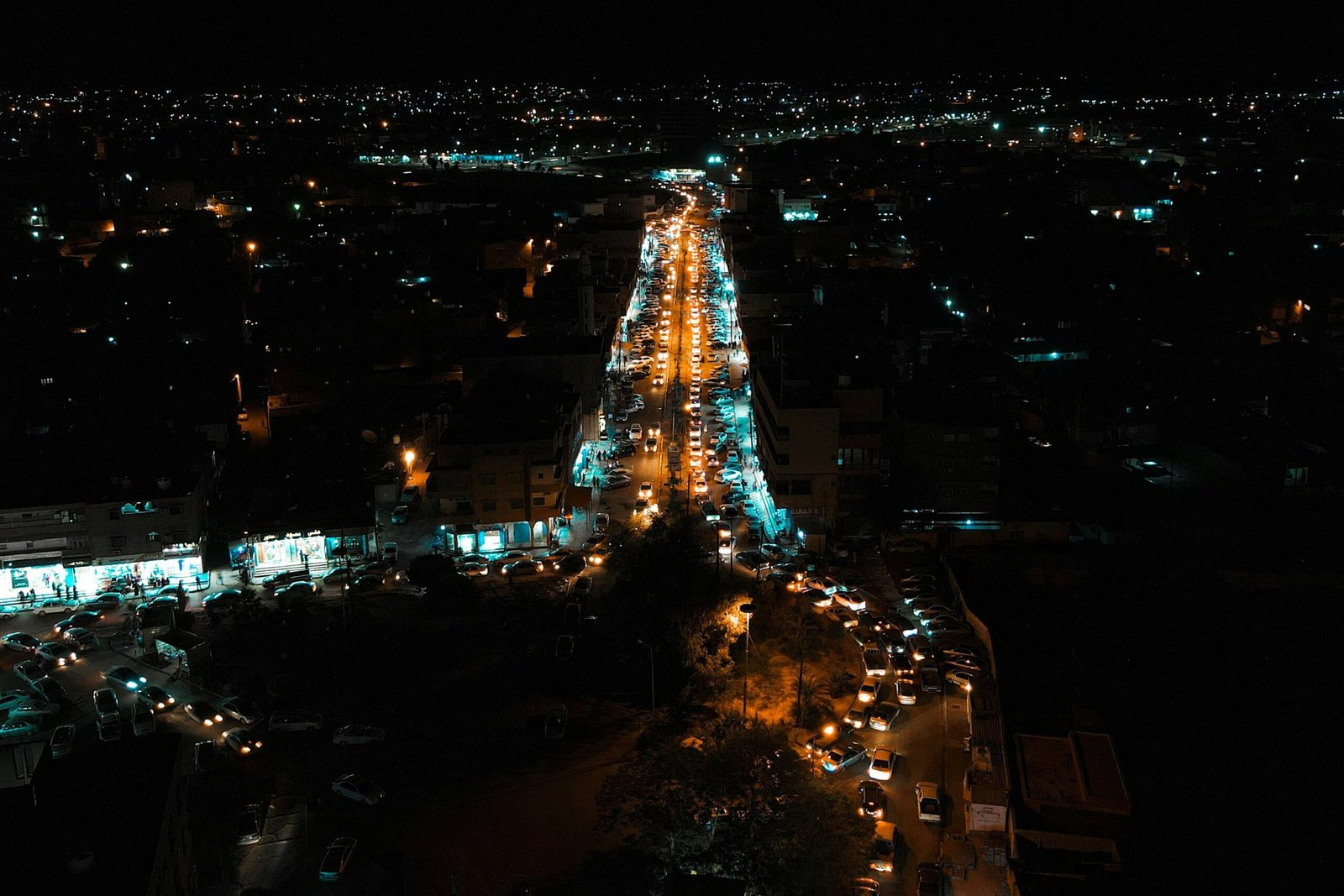 an aerial view of a city street at night